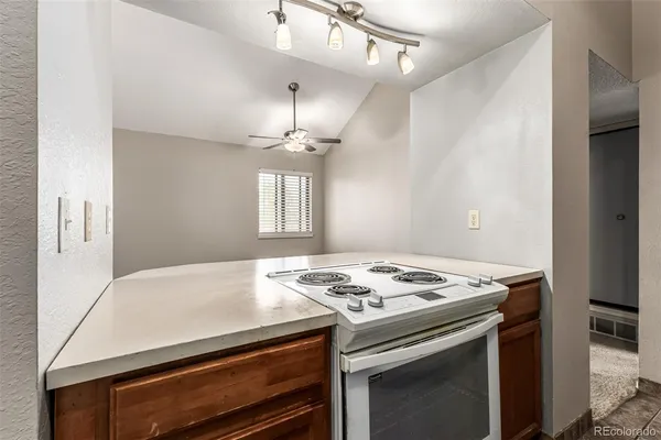 a kitchen with stainless steel appliances granite countertop a sink stove and microwave