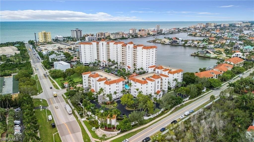 Located on bay for views and boating and a very short walk to Naples world-renown white-sand beaches!