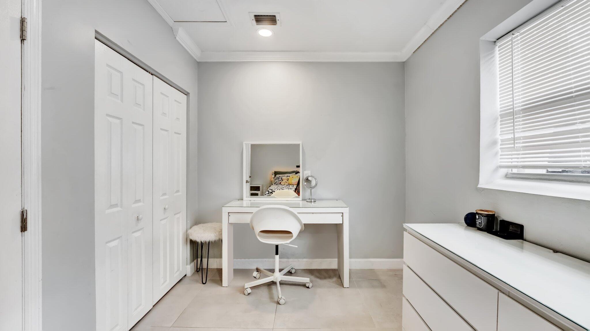 9709 Southwest 1st Place Boca Raton, FL 33428 - Photo 12 of 32 a room with a chair and a table in it