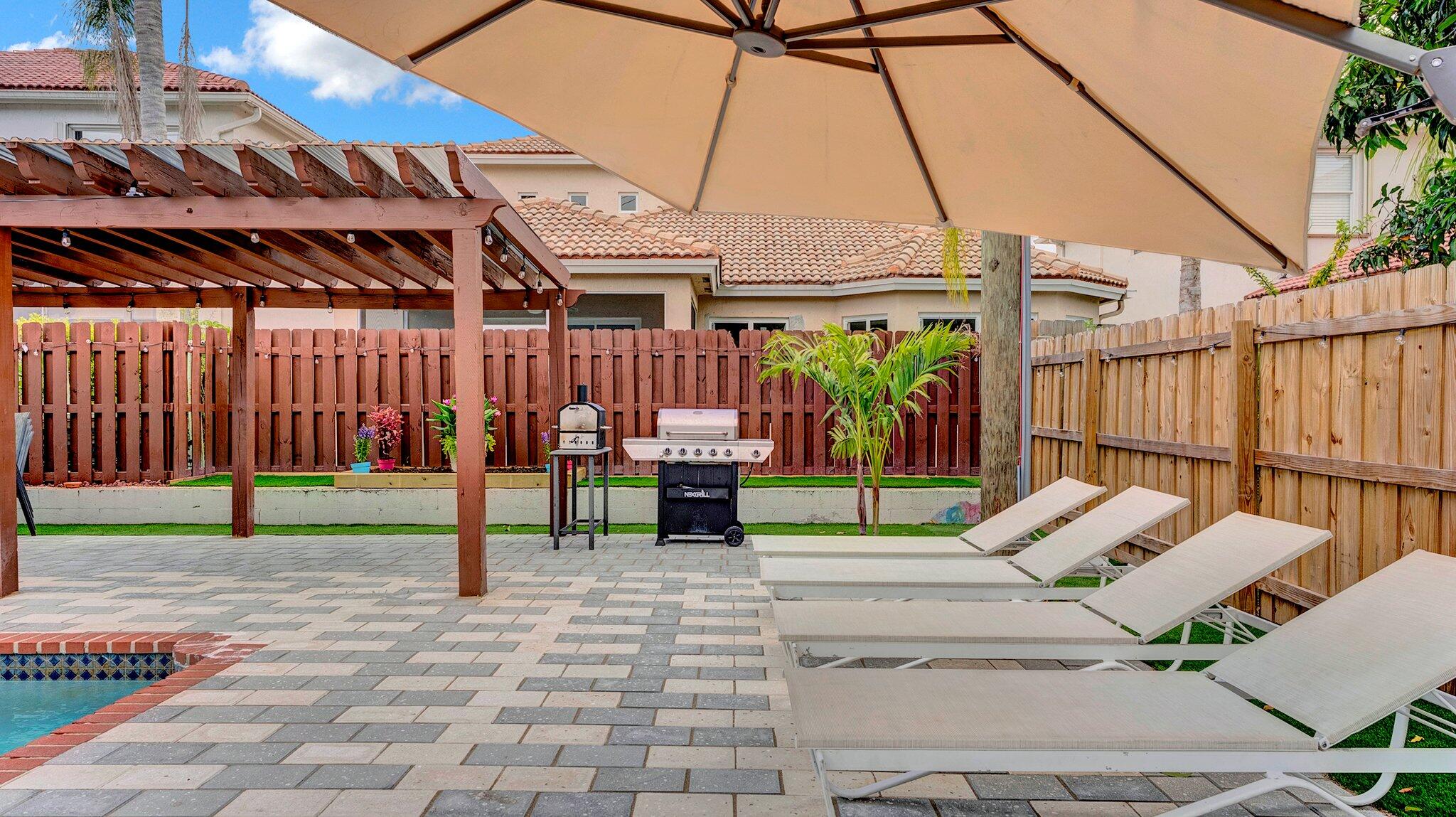9709 Southwest 1st Place Boca Raton, FL 33428 - Photo 21 of 32 a view of yard with sitting area