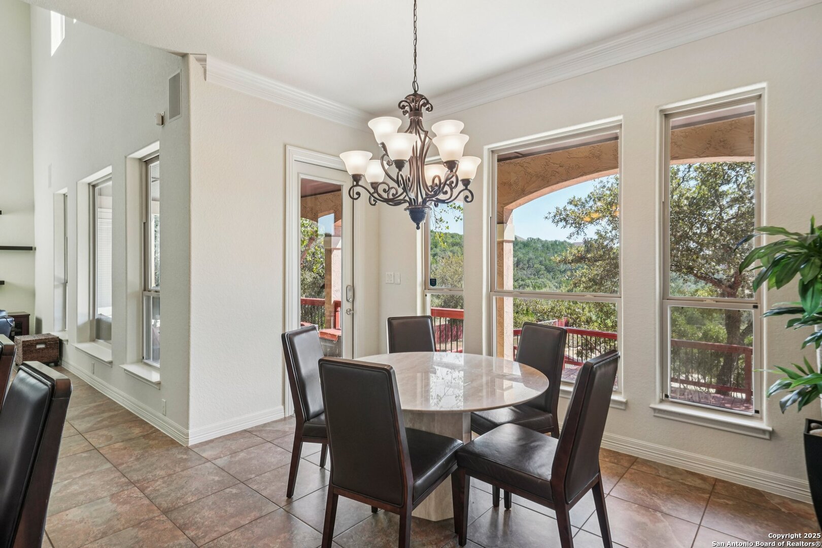 718 Ruidosa Downs Helotes, TX 78023 - Photo 9 of 50 a view of a dining room with furniture window and outside view
