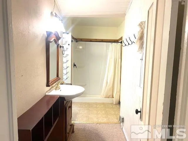 a bathroom with a sink a vanity and a mirror