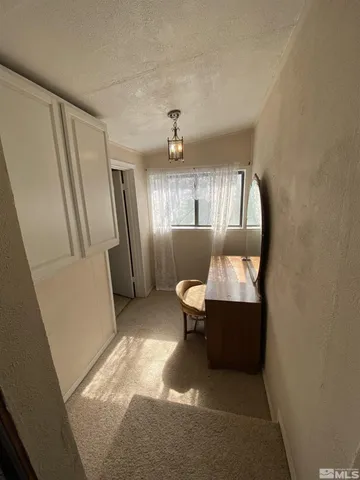 a bedroom with furniture window and wooden floor