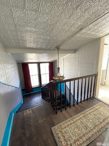 a bathroom with a toilet and a mirror