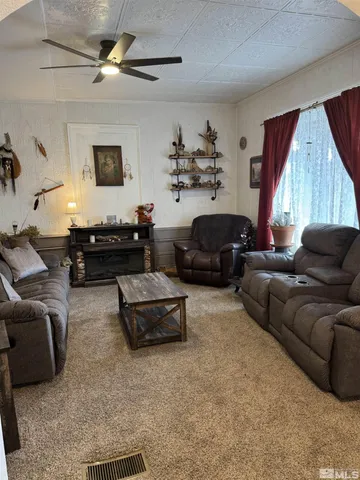 a view of a livingroom with furniture and window