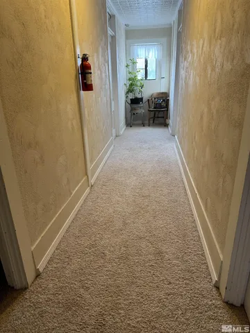 a bedroom with a bed and dresser