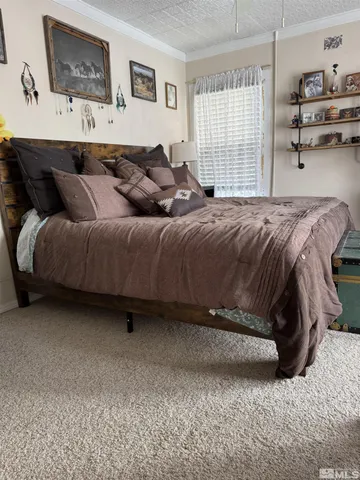 a bedroom with a bed and cabinets