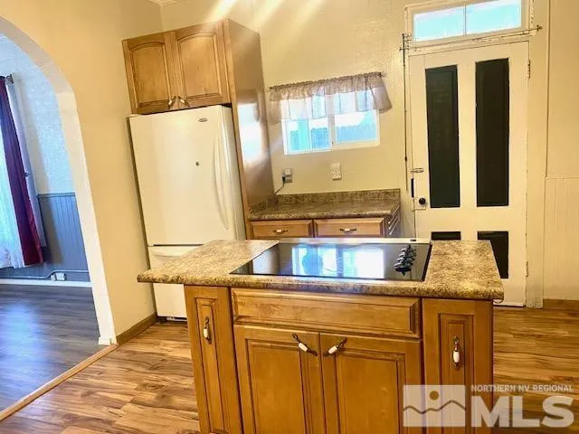 a large kitchen with stainless steel appliances granite countertop a large center island and a sink