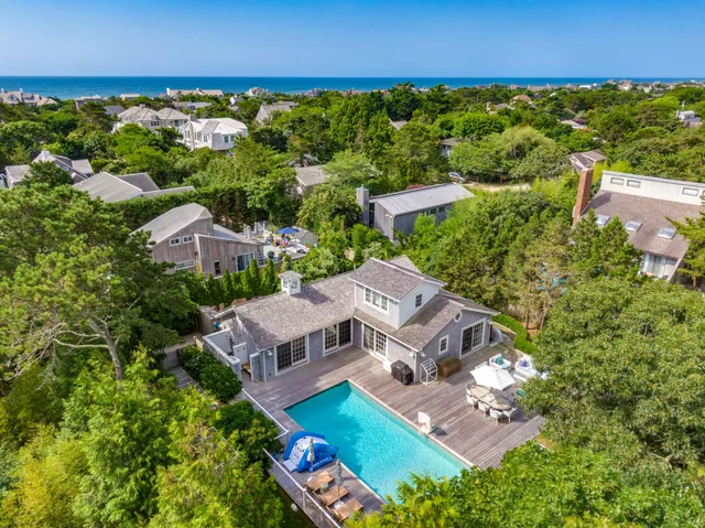 an aerial view of a house with a garden