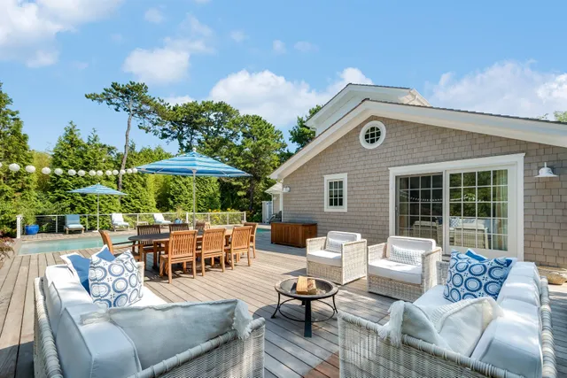 a outdoor space with patio the couches and a potted plant on the table