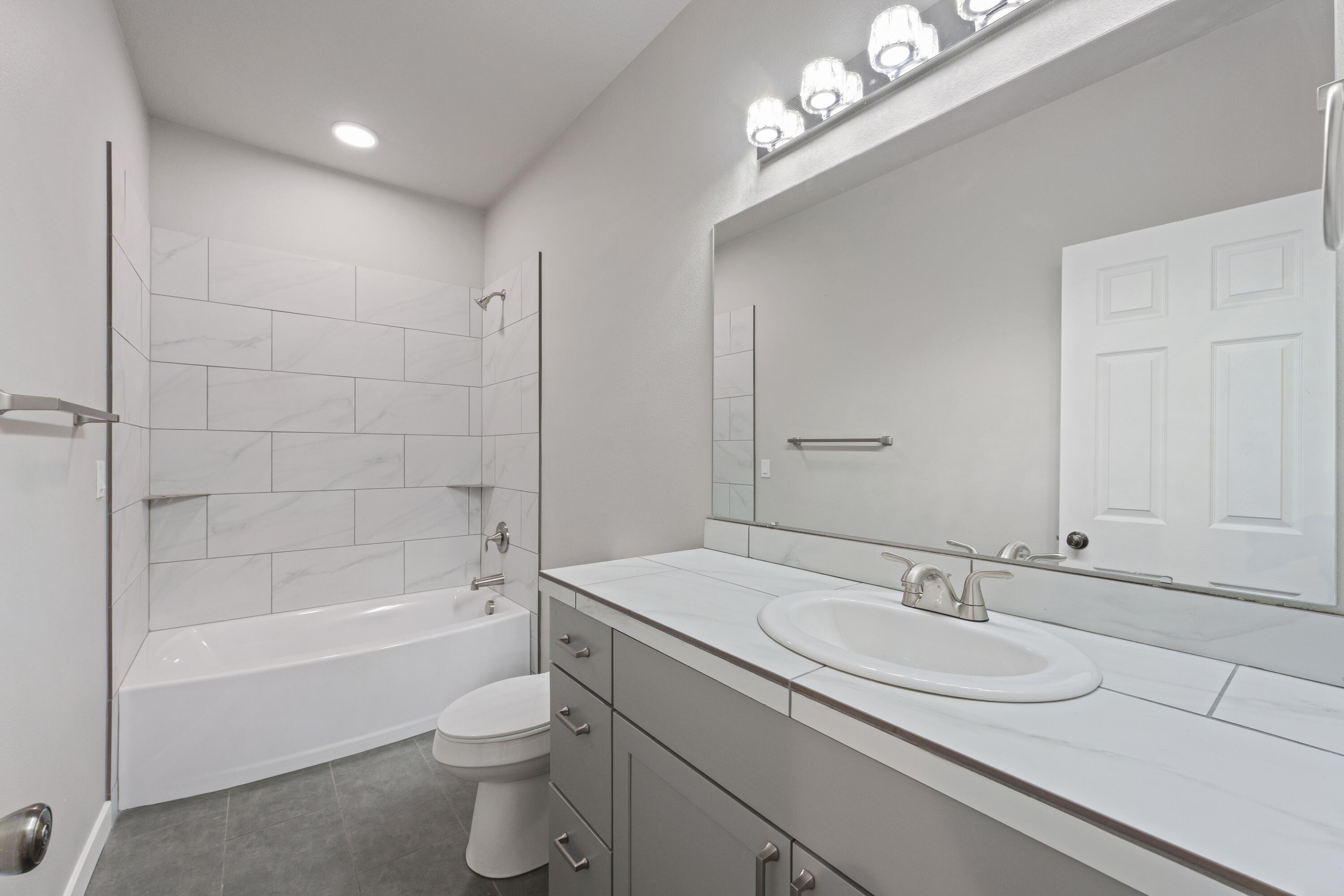 21189 Ritz Place Bend, OR 97702 - Photo 12 of 37 a bathroom with a sink a toilet and shower