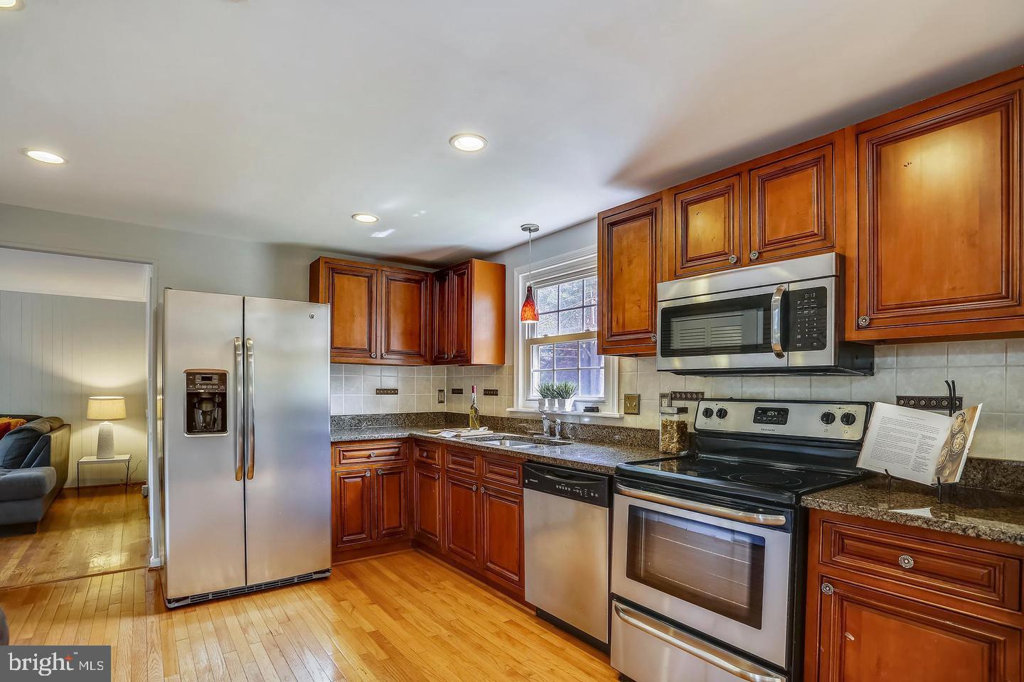 15428 Wembrough Street Silver Spring, MD 20905 - Photo 13 of 36 Updated Kitchen view to Family Room