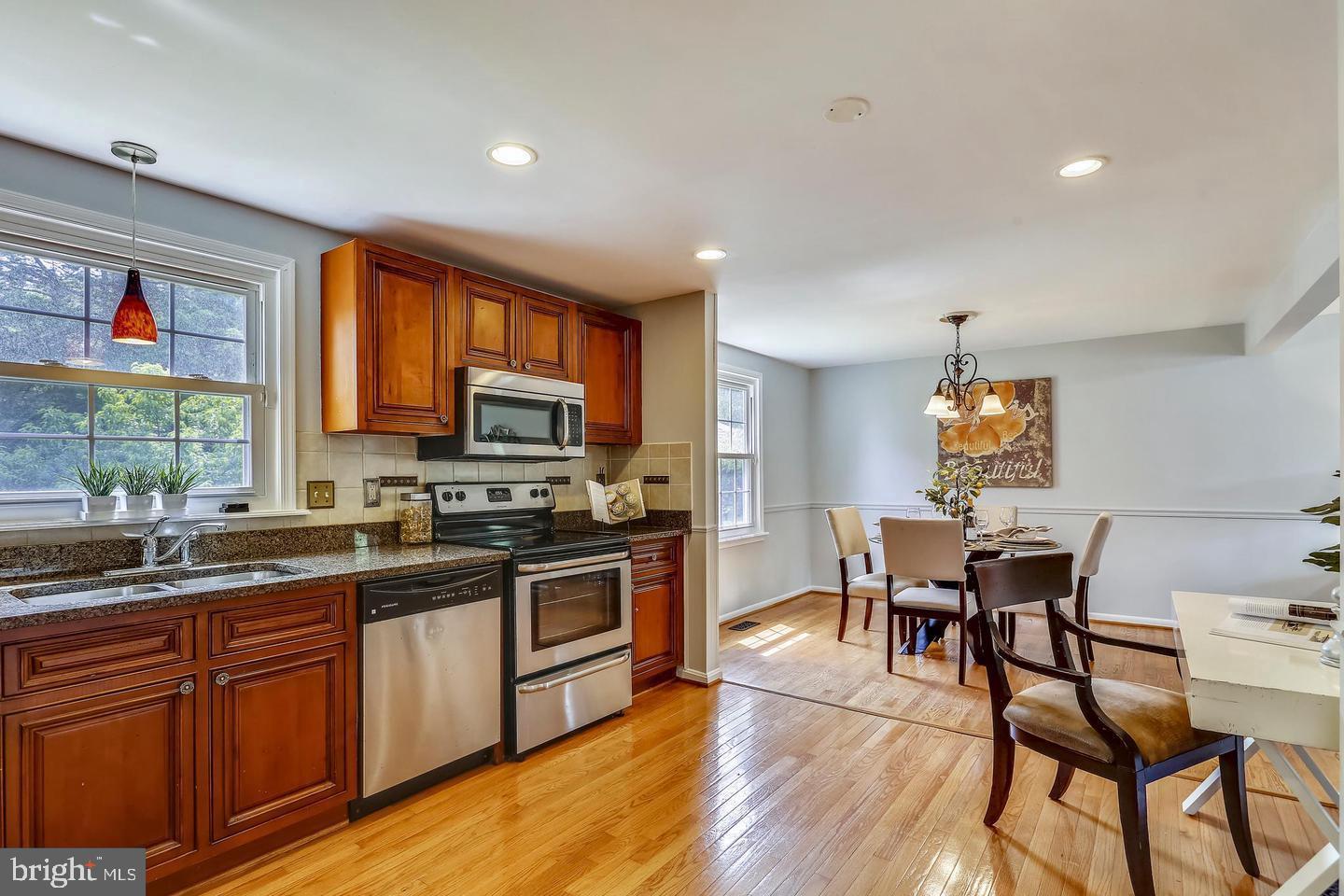 15428 Wembrough Street Silver Spring, MD 20905 - Photo 15 of 36 Kitchen Open Floor to Dining Room