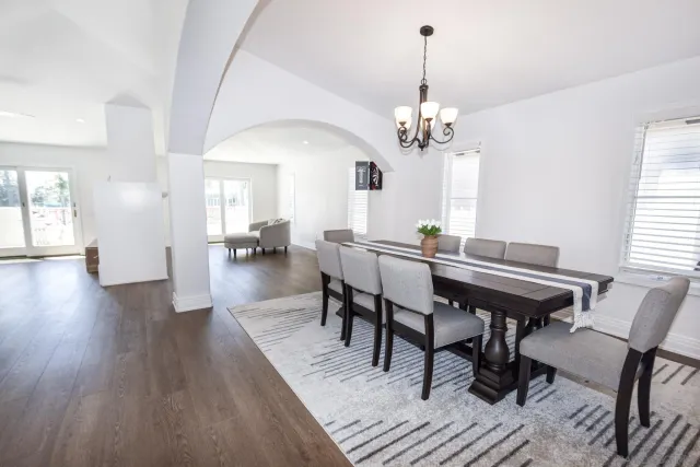 a view of a dining room with furniture window and wooden floor
