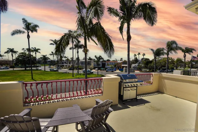 a view of a swimming pool with a table and chairs