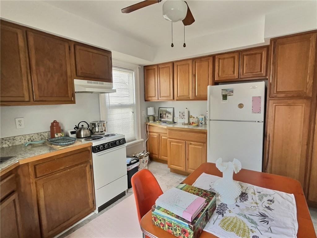 724 Washington Street, Unit 2 Sewickley, PA 15143 - Photo 6 of 18 a kitchen with stainless steel appliances granite countertop a refrigerator stove microwave and sink