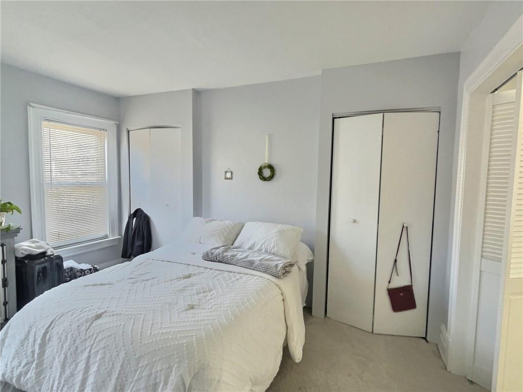 724 Washington Street, Unit 2 Sewickley, PA 15143 - Photo 10 of 18 a bedroom with a bed and a window