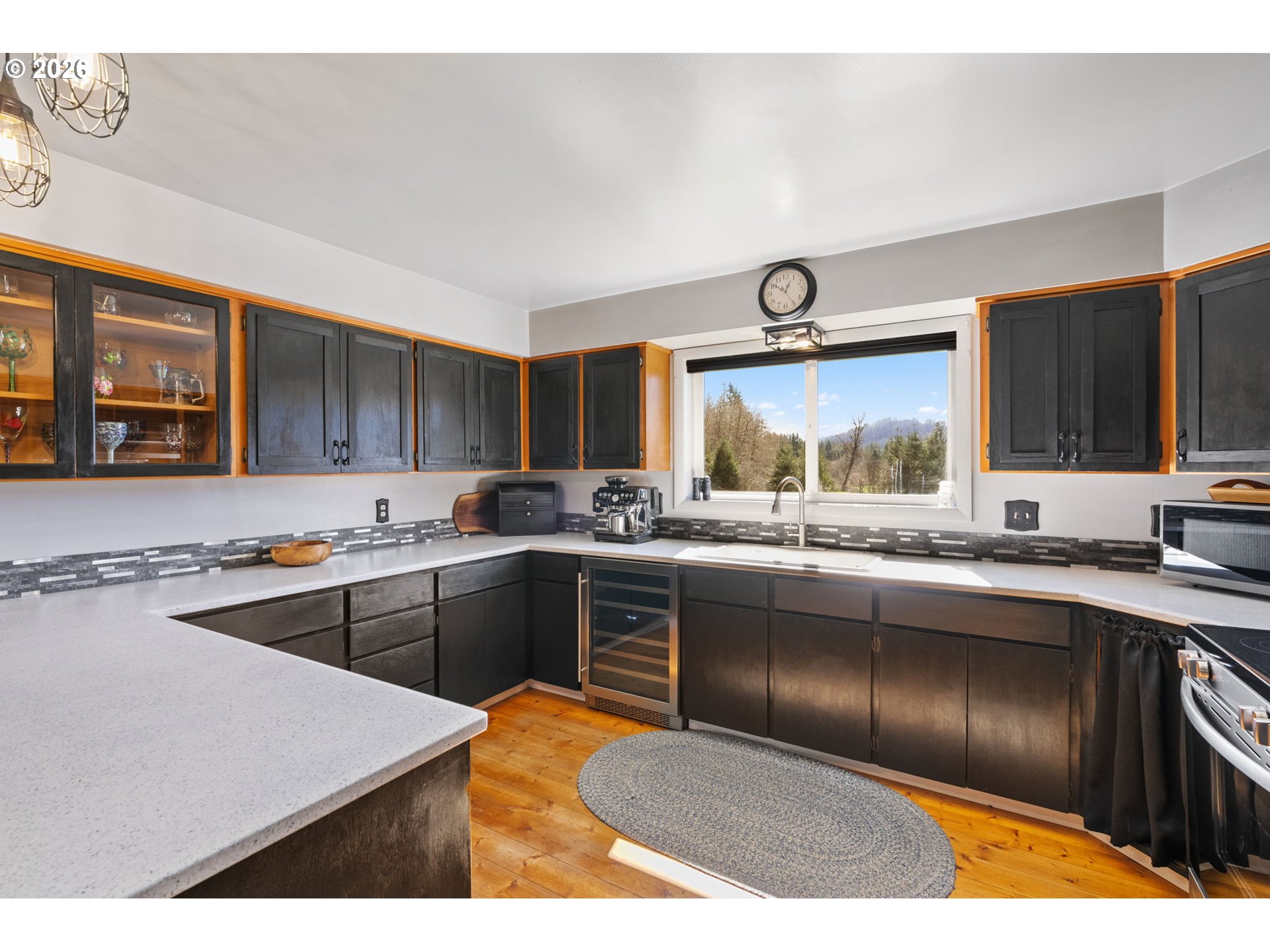 15052 Lewis River Road Ariel, WA 98603 - Photo 12 of 40 a kitchen with a sink stove and cabinets