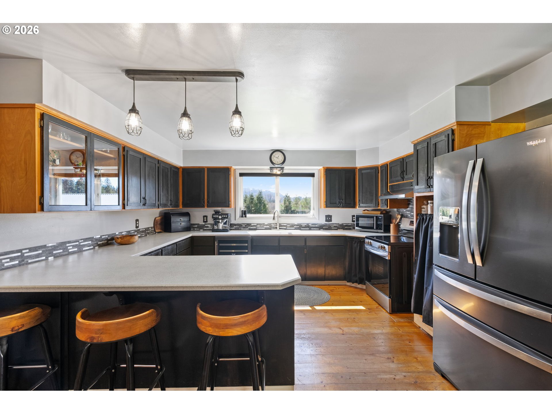 15052 Lewis River Road Ariel, WA 98603 - Photo 14 of 40 a kitchen with stainless steel appliances granite countertop a sink and a refrigerator