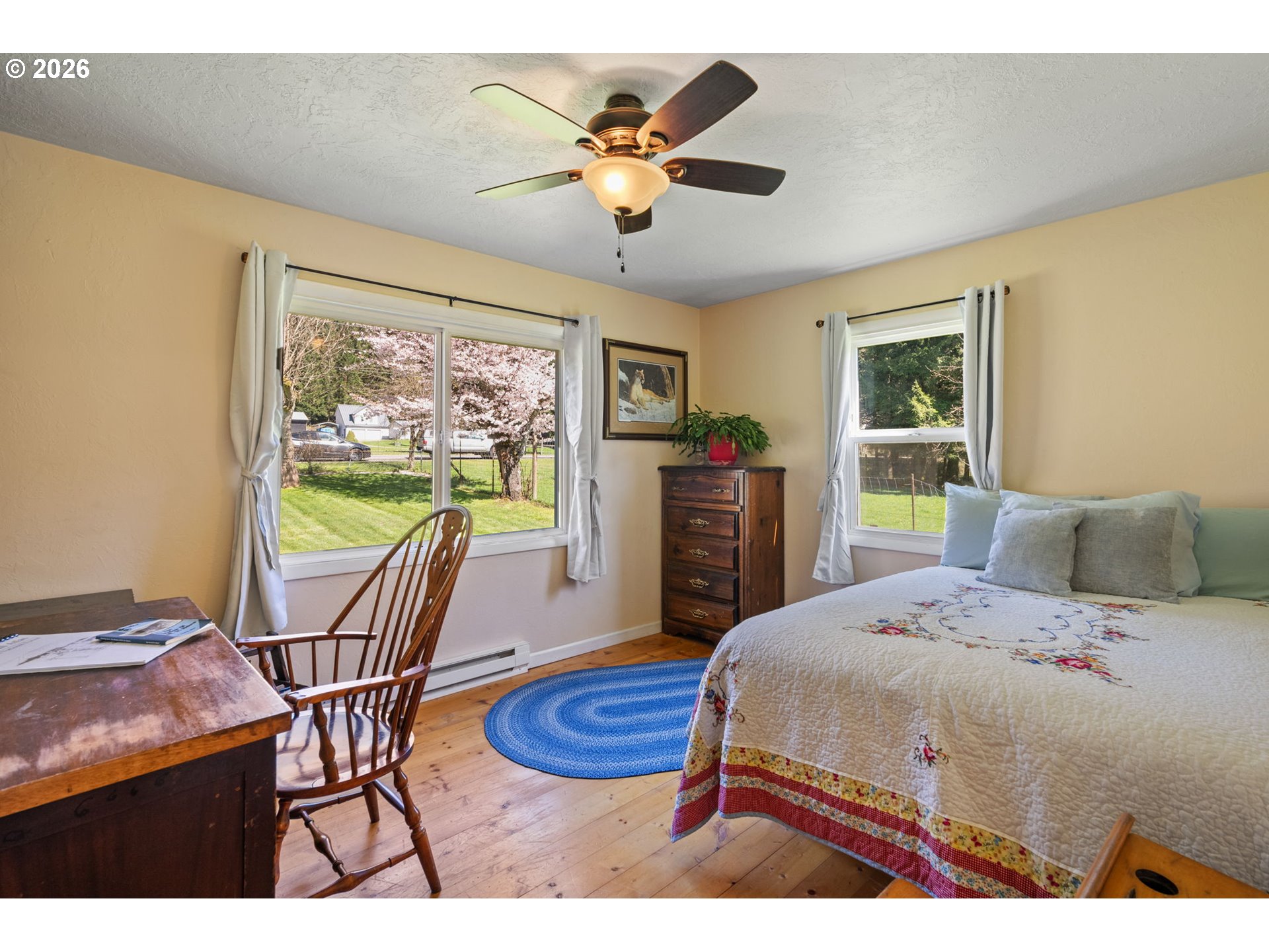 15052 Lewis River Road Ariel, WA 98603 - Photo 17 of 40 a bedroom with a bed and a table