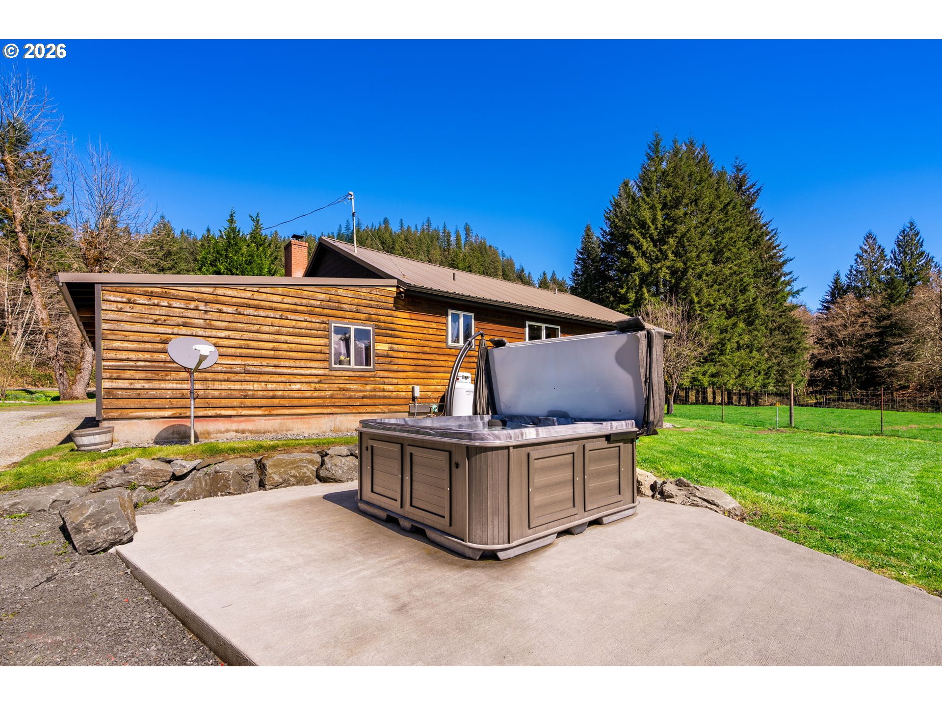 15052 Lewis River Road Ariel, WA 98603 - Photo 21 of 40 a backyard of a house with table and chairs