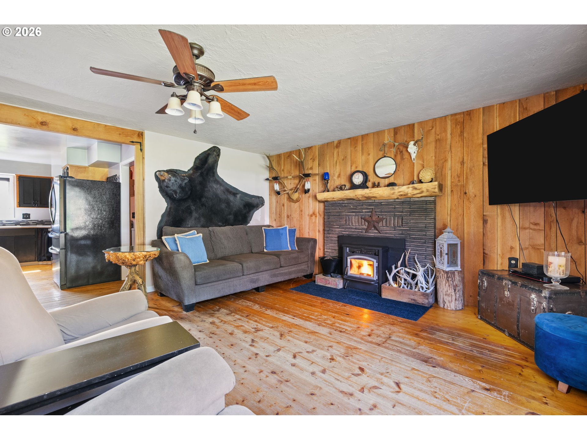 15052 Lewis River Road Ariel, WA 98603 - Photo 9 of 40 a living room with furniture and a fireplace