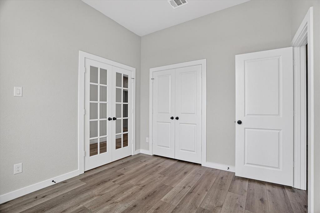 317 Skeen Peak Springtown, TX 76082 - Photo 13 of 31 Wood-finish flooring throughout