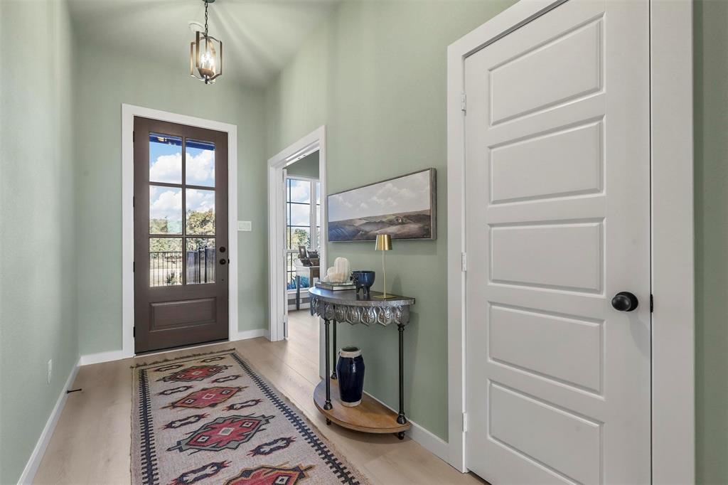 317 Skeen Peak Springtown, TX 76082 - Photo 2 of 14 a bedroom with a bed and a dresser