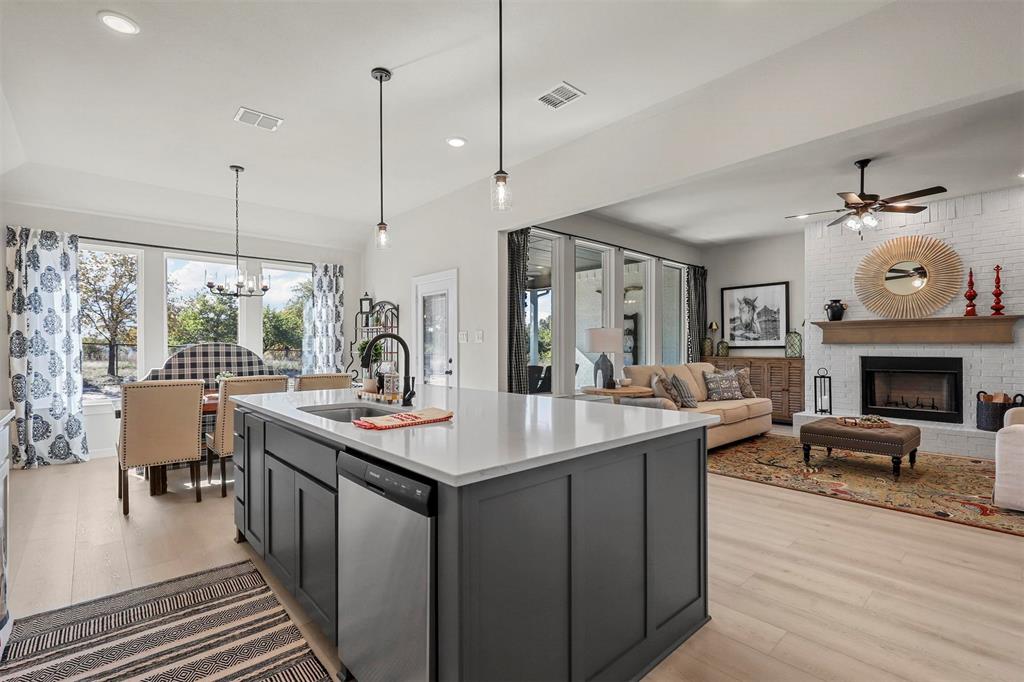 317 Skeen Peak Springtown, TX 76082 - Photo 6 of 14 a kitchen with a sink stove and wooden floor