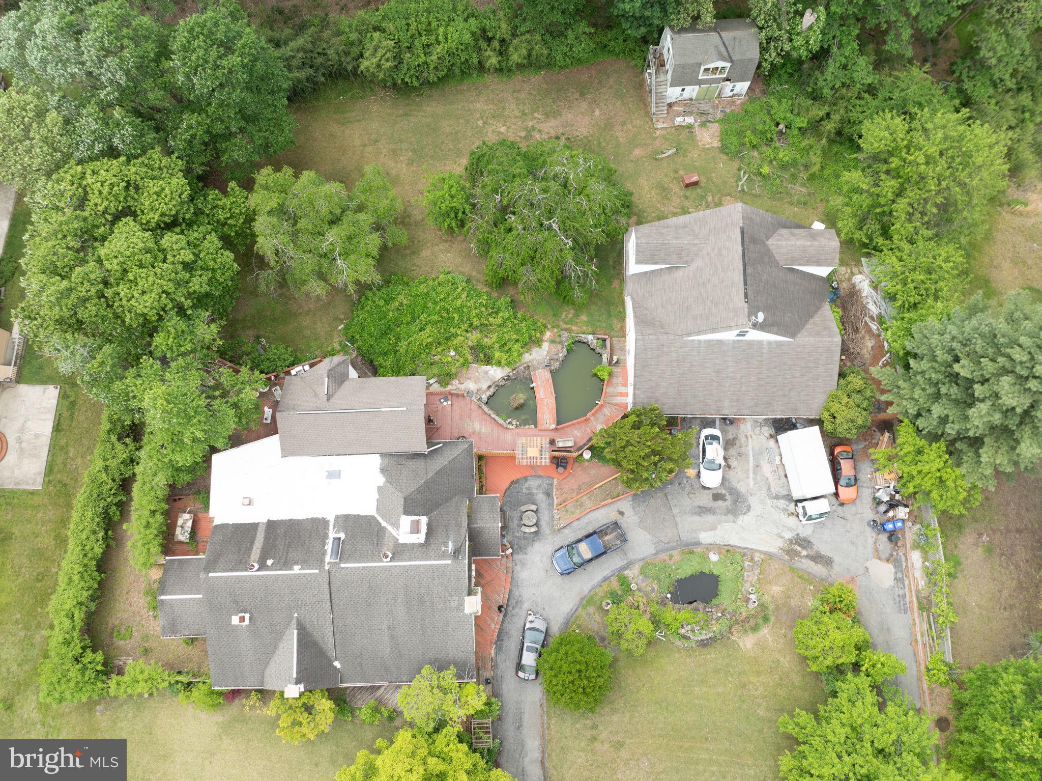 3502 Mitchellville Road Bowie, MD 20716 - Photo 9 of 14 an aerial view of a house with outdoor space and a lake view in back