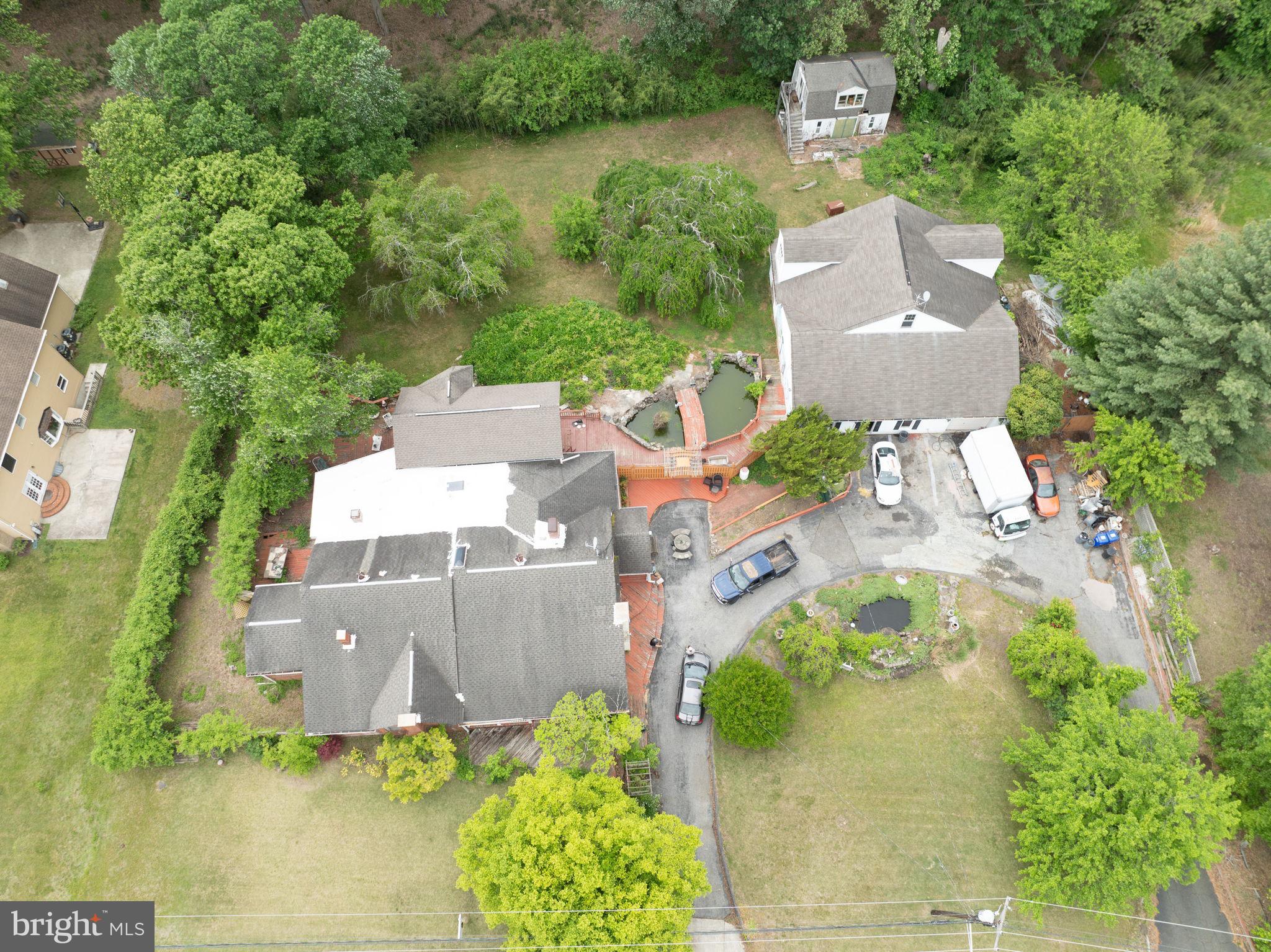 3502 Mitchellville Road Bowie, MD 20716 - Photo 10 of 14 an aerial view of a house with a garden and swimming pool