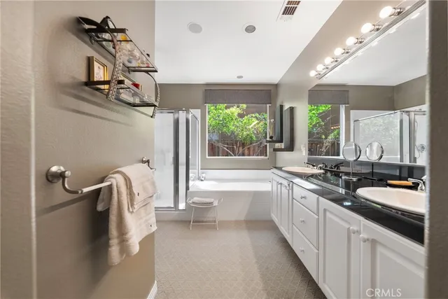 a large white kitchen with a large window