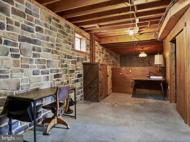 a view of a lush green hillside and a building in the background
