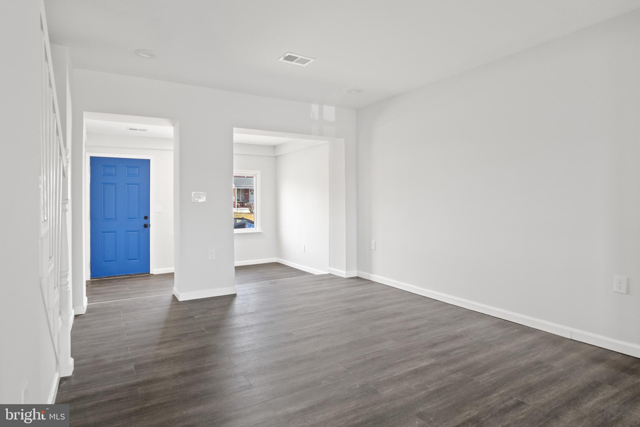 7841 Charlesmont Road Baltimore, MD 21222 - Photo 11 of 43 a view of an empty room with wooden floor and closet