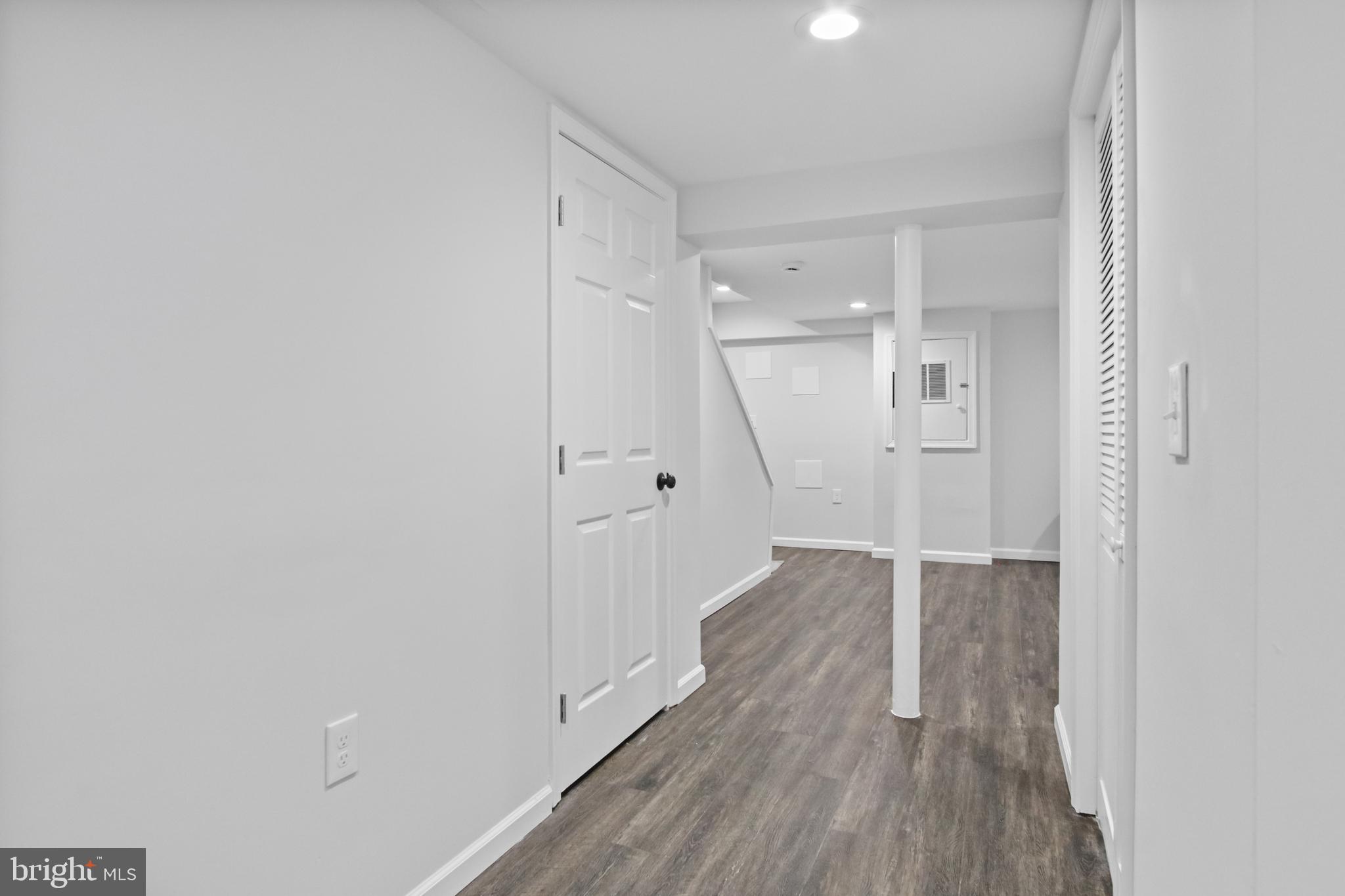 7841 Charlesmont Road Baltimore, MD 21222 - Photo 22 of 43 a view of a hallway with wooden floor