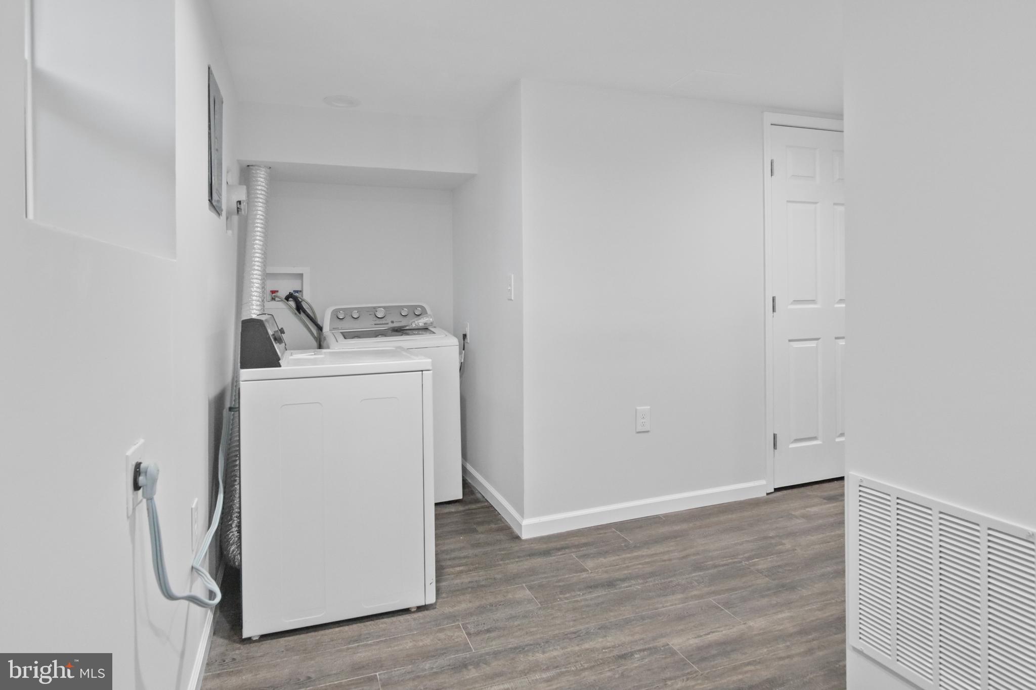 7841 Charlesmont Road Baltimore, MD 21222 - Photo 23 of 43 a utility room with dryer and washer
