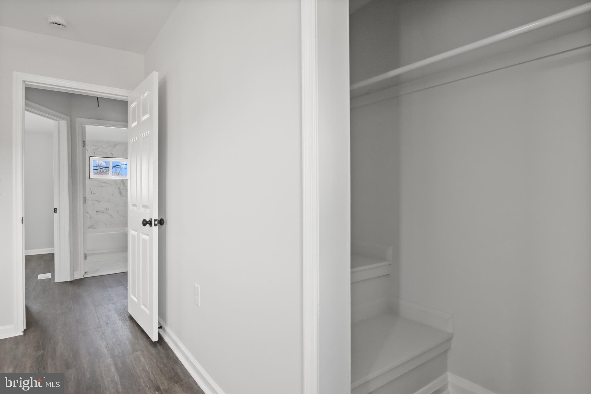 7841 Charlesmont Road Baltimore, MD 21222 - Photo 30 of 43 a view of a hallway with wooden floor