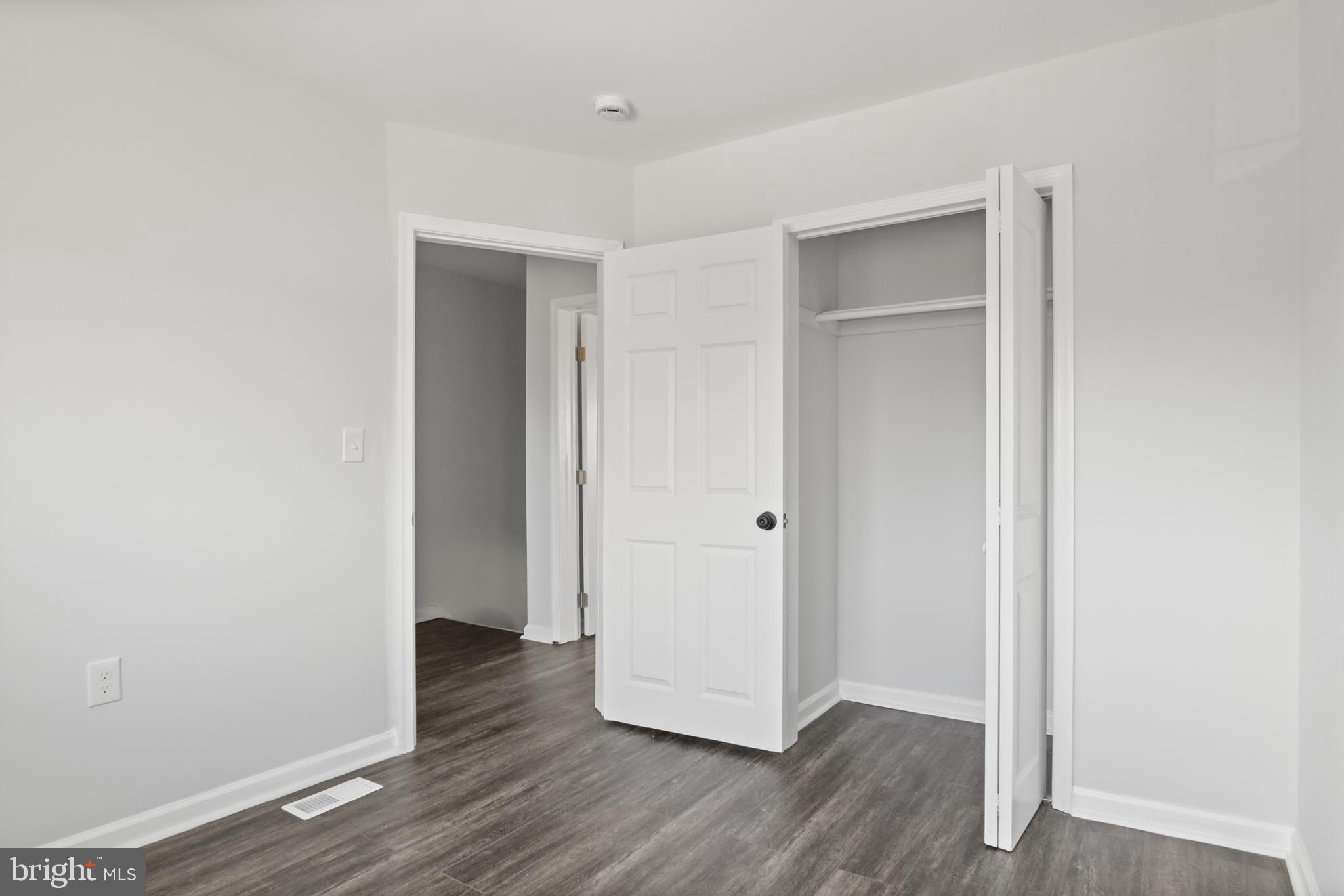 7841 Charlesmont Road Baltimore, MD 21222 - Photo 33 of 43 a view of an empty room with wooden floor and closet