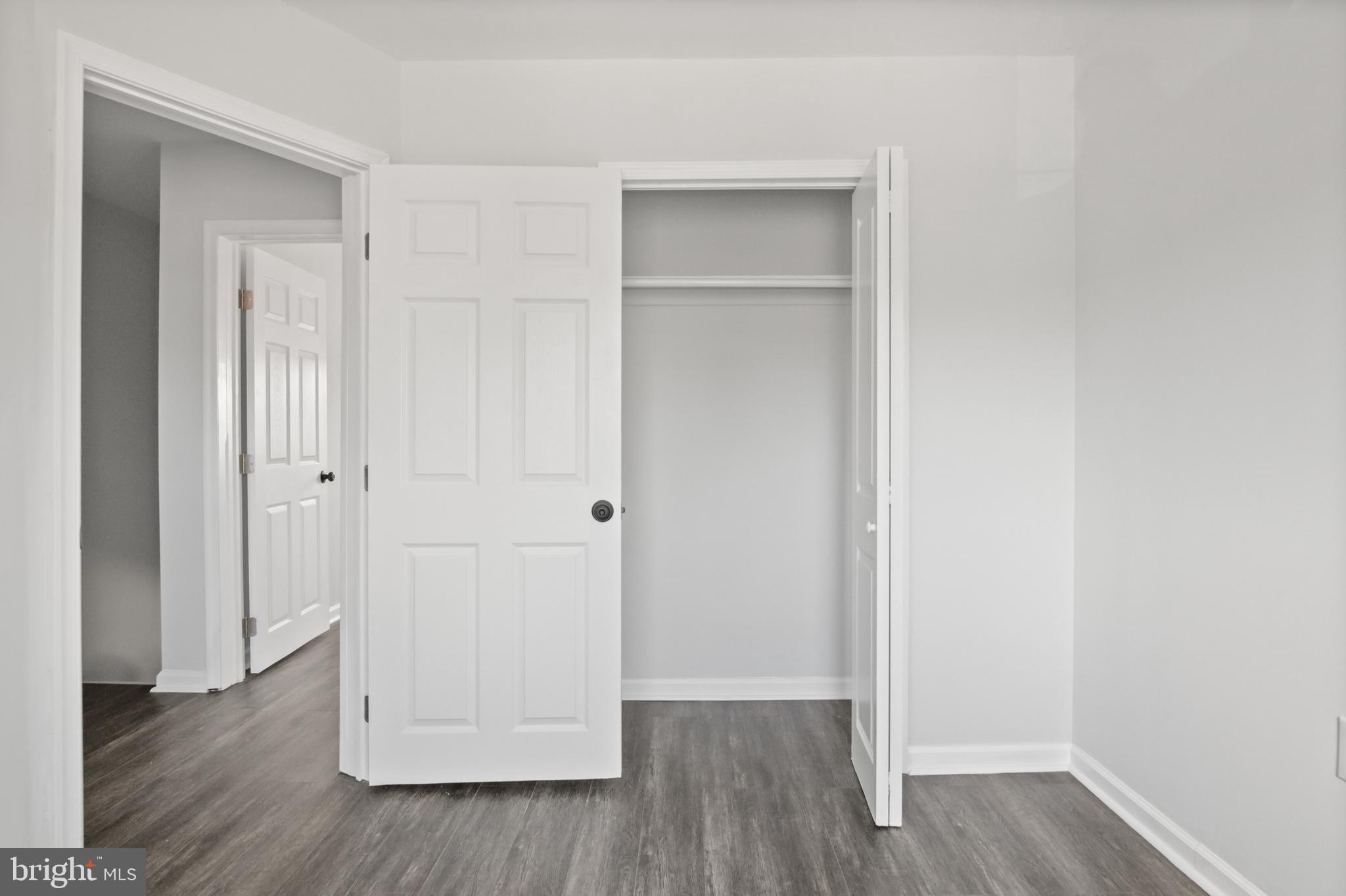 7841 Charlesmont Road Baltimore, MD 21222 - Photo 34 of 43 a view of an empty room with wooden floor