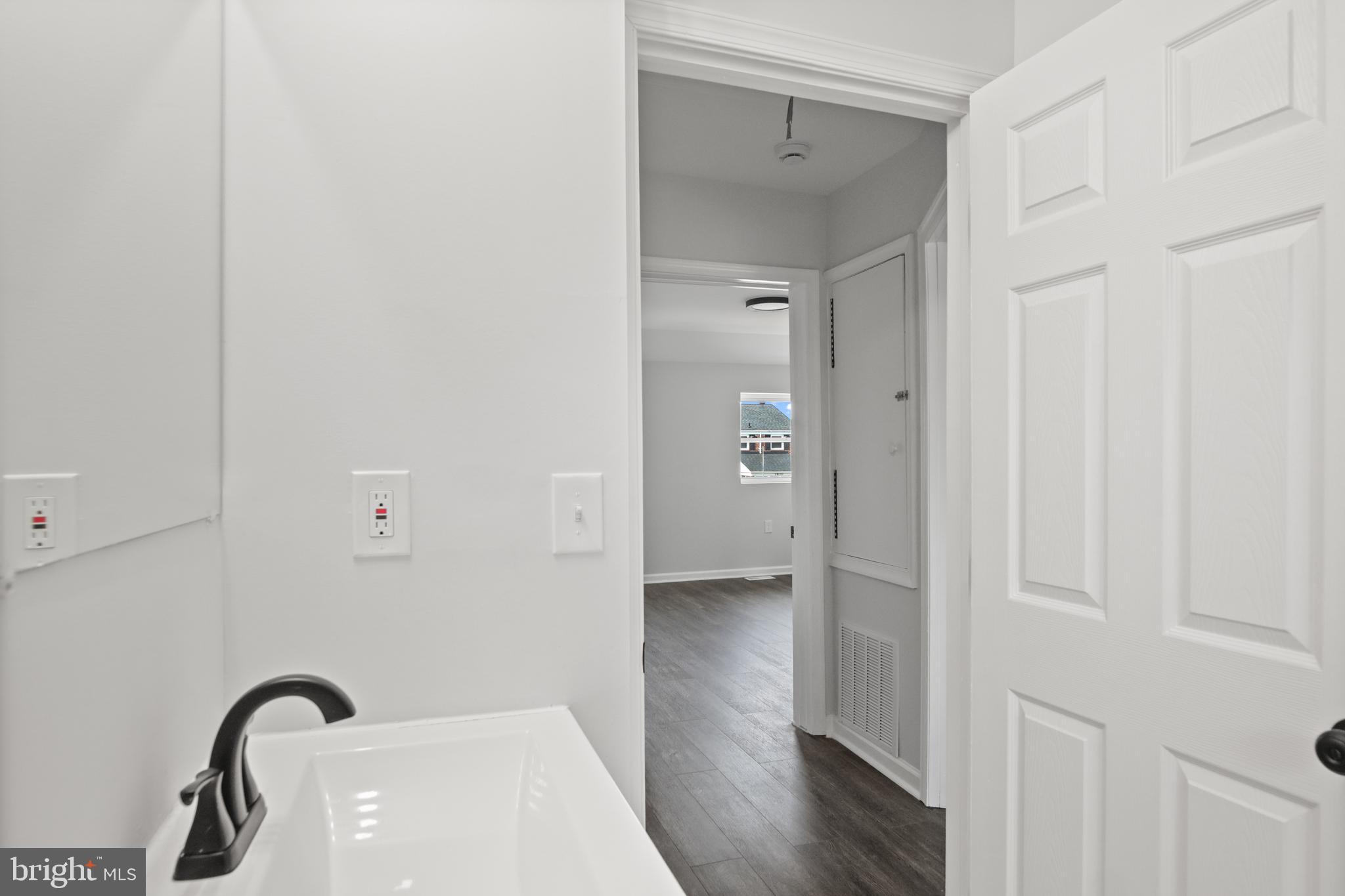 7841 Charlesmont Road Baltimore, MD 21222 - Photo 37 of 43 a view of a bathroom with a sink
