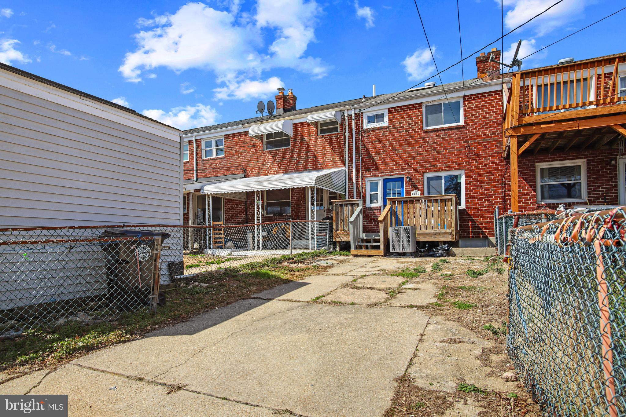 7841 Charlesmont Road Baltimore, MD 21222 - Photo 43 of 43 a front view of a house with a yard
