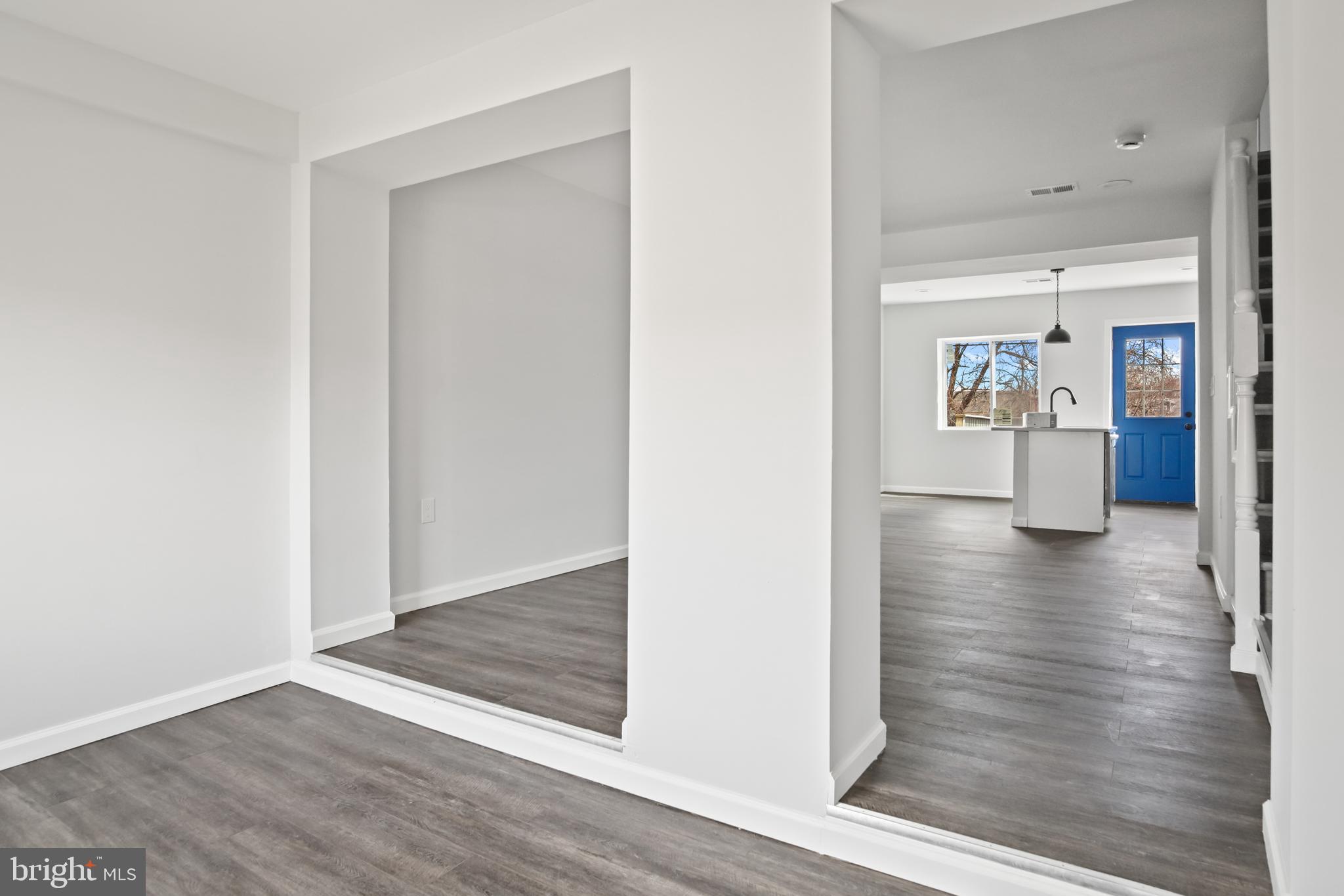 7841 Charlesmont Road Baltimore, MD 21222 - Photo 5 of 43 a view of a hallway with wooden floor