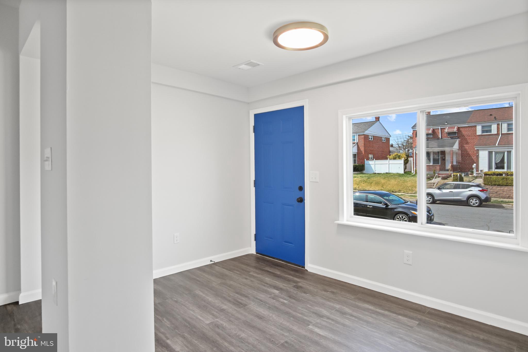 7841 Charlesmont Road Baltimore, MD 21222 - Photo 7 of 43 a view of an empty room with a window