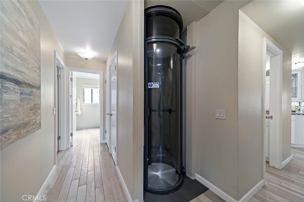 6247 Majorca Circle Long Beach, CA 90803 - Photo 17 of 57 a bathroom with a sink and glass door