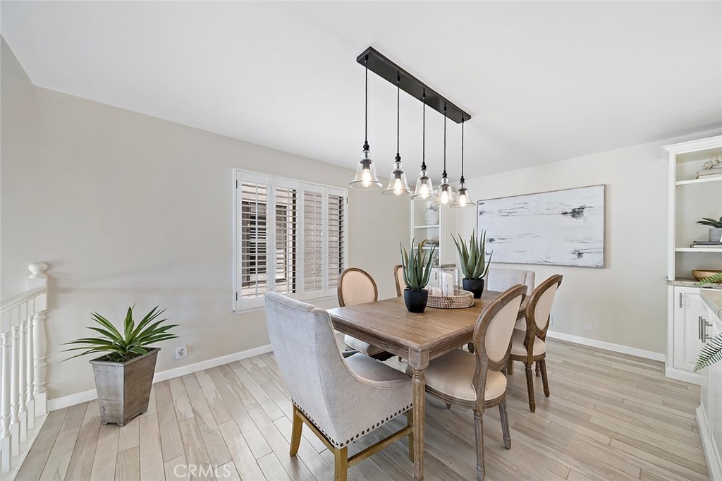 6247 Majorca Circle Long Beach, CA 90803 - Photo 2 of 57 a dining room with furniture potted plants and wooden floor