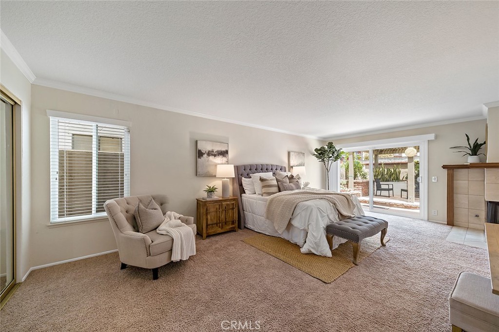 6247 Majorca Circle Long Beach, CA 90803 - Photo 32 of 57 a spacious bedroom with bed and glass window