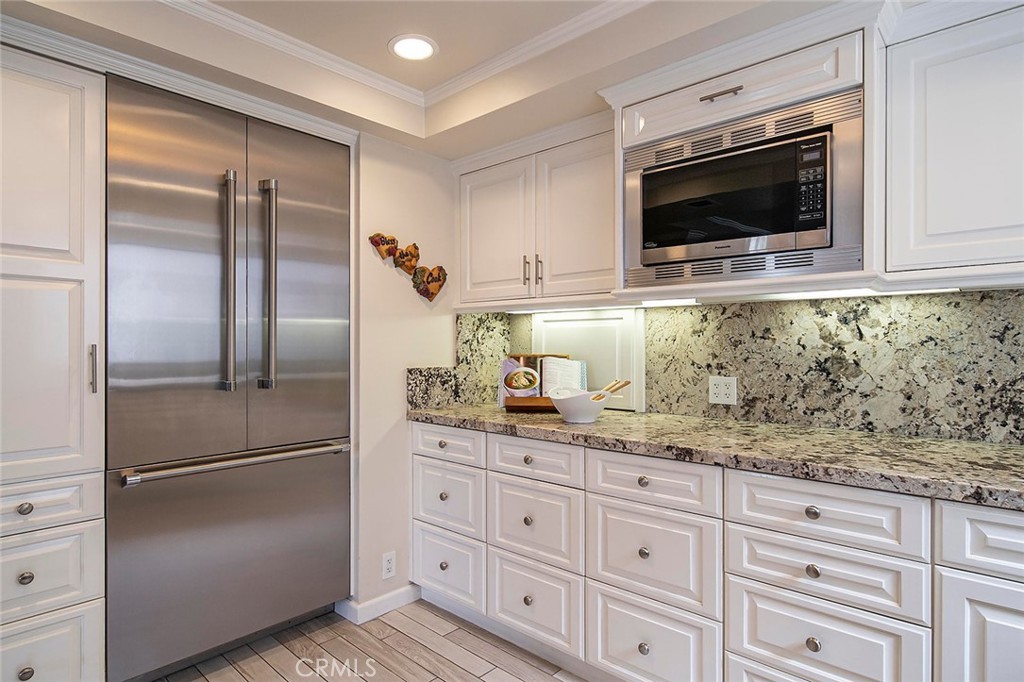 6247 Majorca Circle Long Beach, CA 90803 - Photo 8 of 57 a kitchen with granite countertop a refrigerator and a sink