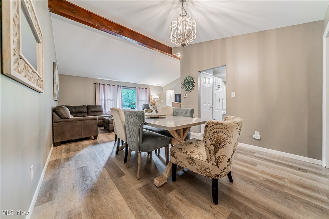 595 Moorfield Road Fairlawn, OH 44313 - Photo 6 of 50 Dining room with light wood-style floors and a chandelier