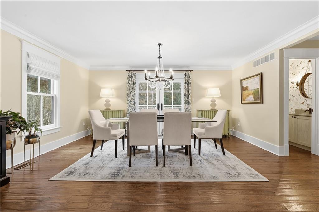 411 Woodland Road Sewickley, PA 15143 - Photo 11 of 46 a view of a dining room with furniture window and wooden floor