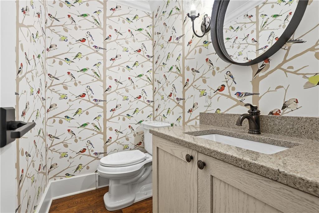 411 Woodland Road Sewickley, PA 15143 - Photo 13 of 46 a bathroom with a granite countertop toilet and a sink